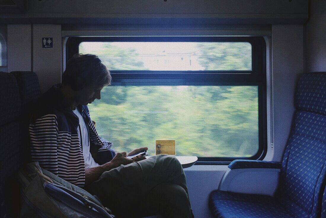 Guy on train with phone