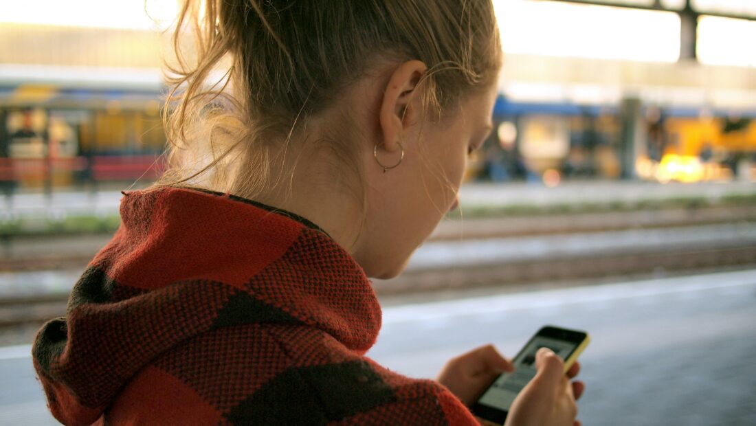 Checking her smartphone